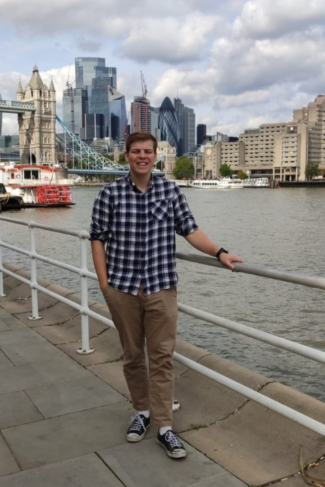Aaron in front of the London skyline